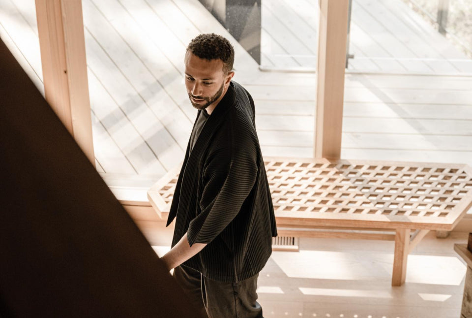 Photo of Trent Rodney in the sunlit Geometric House